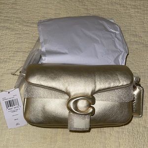 Coach pillow tabby 18 in gold